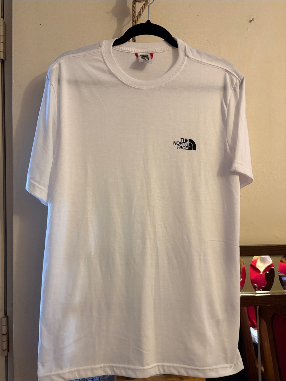 The North Face White Short Sleeve Tee with Black Chest Logo. Cotton